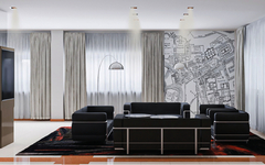 Lounge eines Hotels in Rom mit schwarzen Sofas und Stadtplan an der Wand.