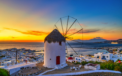 Traditional Greek windmill at sunset in Mykonos island. Greece