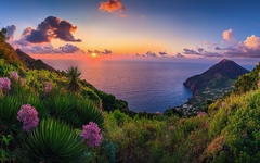 Breathtaking panorama of the Aeolian Islands with Stromboli's active volcano at sunset over the Mediterranean Sea